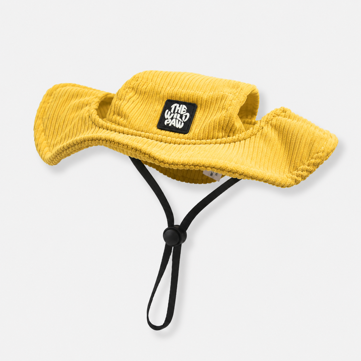 Yellow bucket dog hat with a strap from The Wild Paw brand