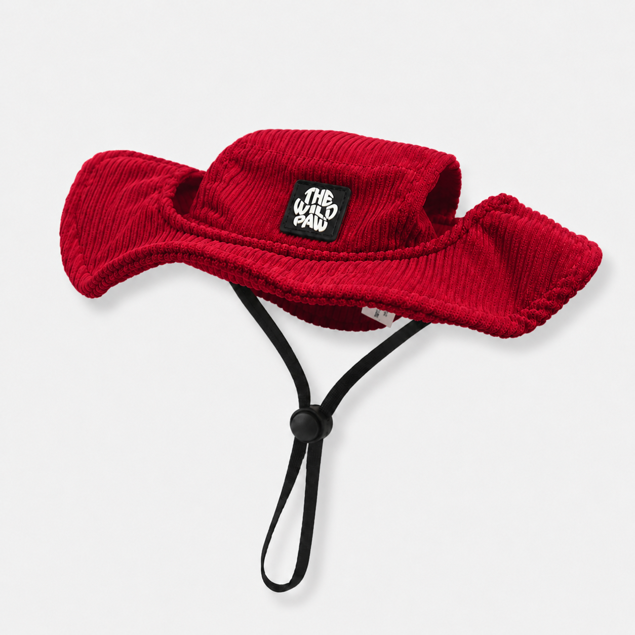 Red bucket dog hat with a strap from The Wild Paw brand