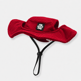Red bucket dog hat with a strap from The Wild Paw brand