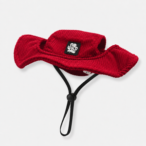 Red bucket dog hat with a strap from The Wild Paw brand